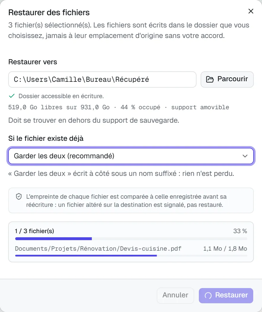 La restauration en cours : 1 fichier sur 3, avec la barre du fichier en cours de réécriture.